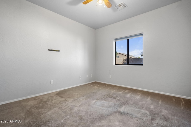 unfurnished room with ceiling fan and carpet flooring