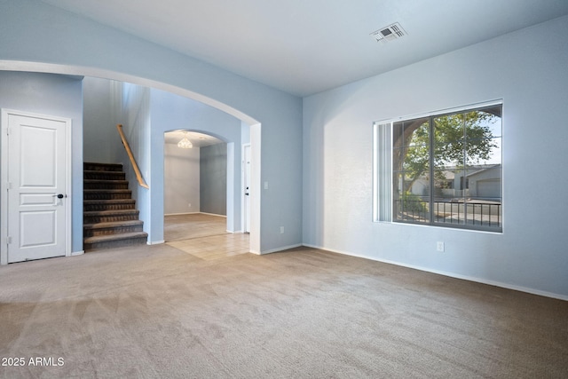 unfurnished living room featuring carpet flooring