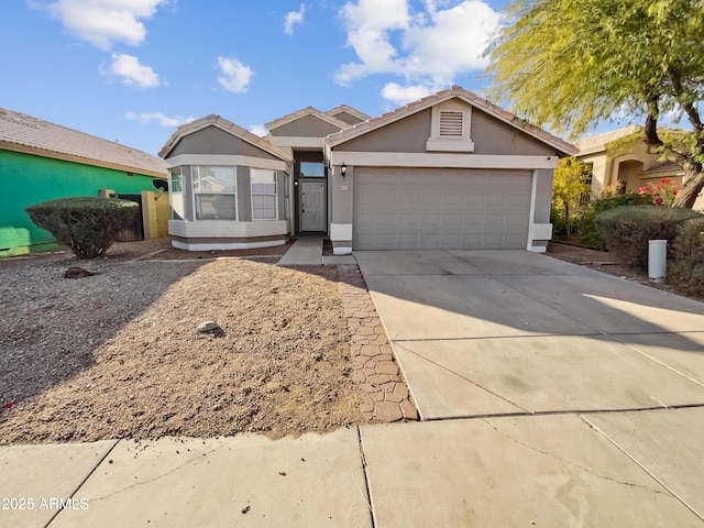 single story home featuring a garage