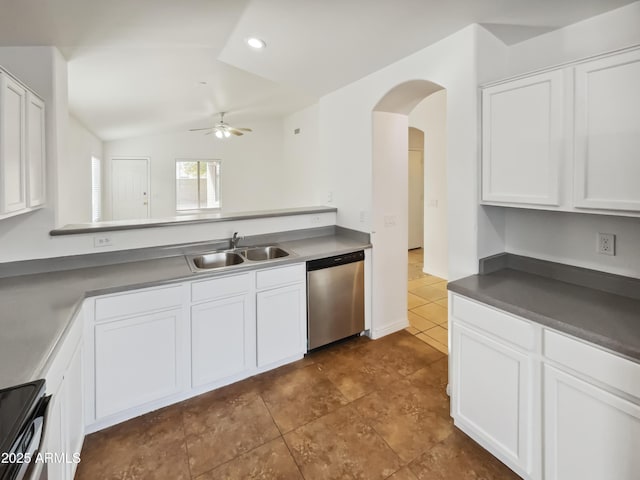 kitchen featuring vaulted ceiling, electric range oven, white cabinetry, sink, and stainless steel dishwasher