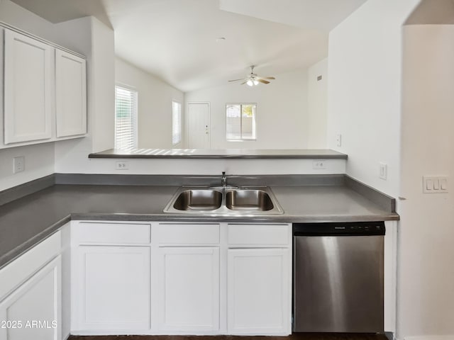 kitchen with lofted ceiling, sink, dishwasher, ceiling fan, and white cabinets