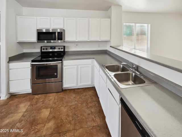 kitchen with white cabinetry, appliances with stainless steel finishes, and sink