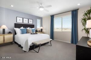 carpeted bedroom featuring a ceiling fan, baseboards, and recessed lighting