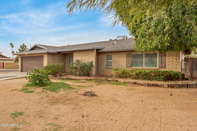 ranch-style house featuring a garage