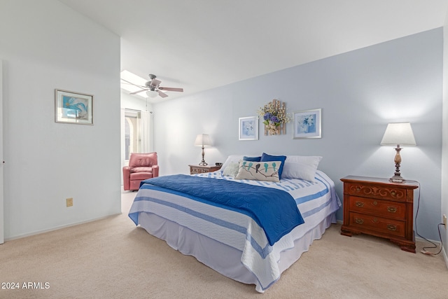 bedroom featuring ceiling fan and light carpet