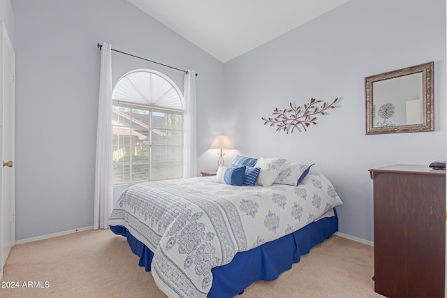 8140 N 107th Ave Unit 129, Peoria, AZ 85345 - bedroom with carpet floors, lofted ceiling, and baseboards