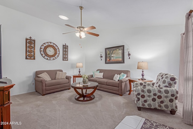 living room with ceiling fan and light colored carpet