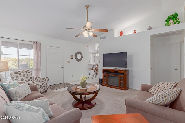 8140 N 107th Ave Unit 129, Peoria, AZ 85345 - living area with carpet floors, ceiling fan, vaulted ceiling, a fireplace, and baseboards