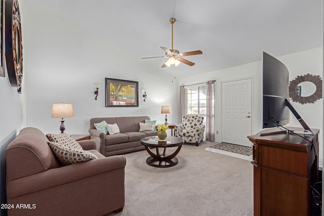 carpeted living room with ceiling fan