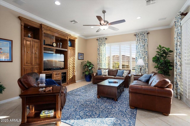 living room featuring ceiling fan, visible vents, and crown molding