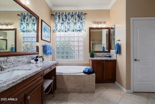 full bathroom featuring two vanities, crown molding, a sink, and a bath