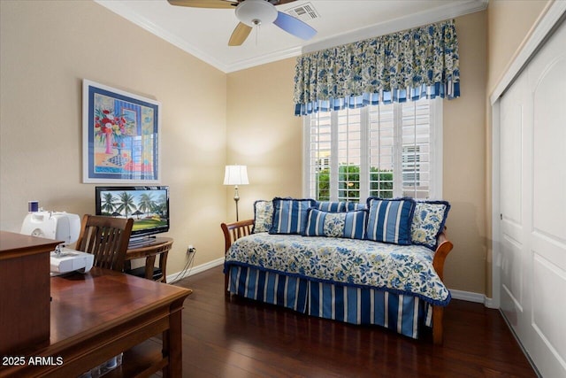 bedroom featuring a closet, visible vents, hardwood / wood-style floors, ornamental molding, and baseboards