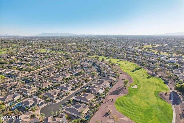 aerial view featuring a residential view, view of golf course, and a mountain view