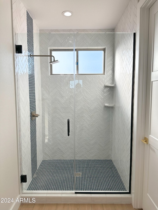 bathroom featuring an enclosed shower