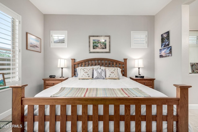 bedroom featuring baseboards