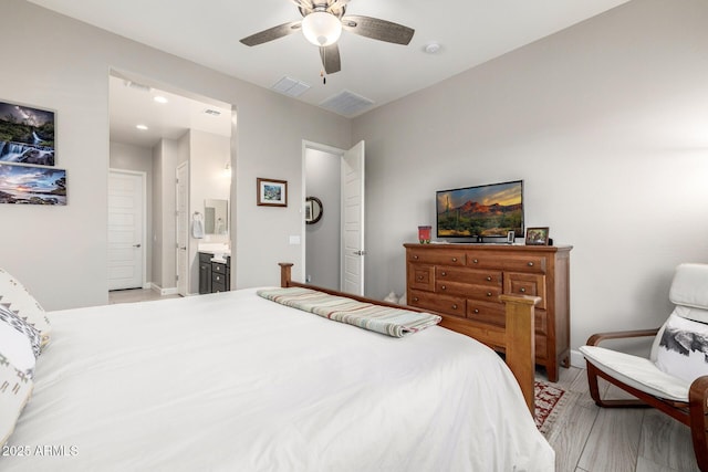 bedroom featuring connected bathroom and a ceiling fan