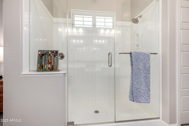 bathroom with a stall shower