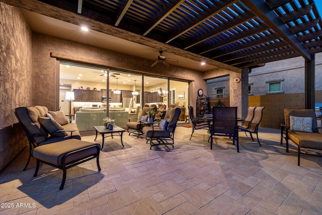 view of patio / terrace with a pergola, a ceiling fan, and outdoor dining space