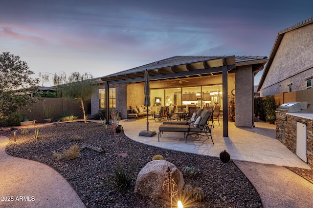 rear view of house with area for grilling, an outdoor hangout area, a fenced backyard, a patio, and a tile roof