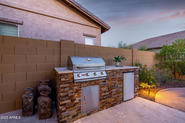 fenced backyard with a patio