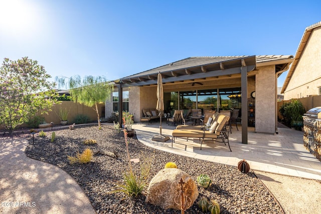 fenced backyard featuring a patio and an outdoor hangout area