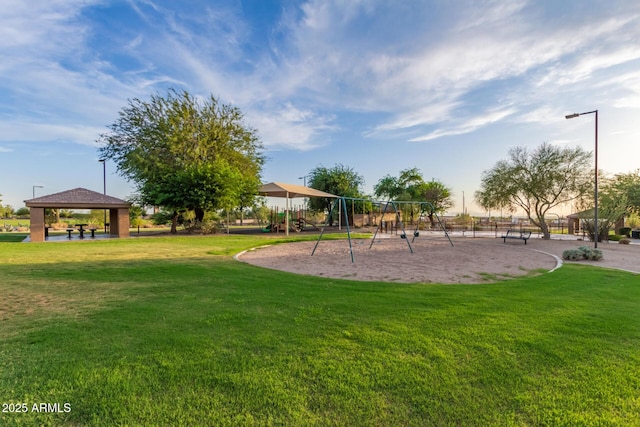 communal playground with a gazebo and a lawn