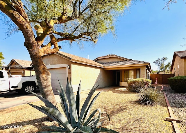 30100 N Sunray Dr, San Tan Valley, AZ 85143 - ranch-style home featuring a garage, stucco siding, and a tile roof