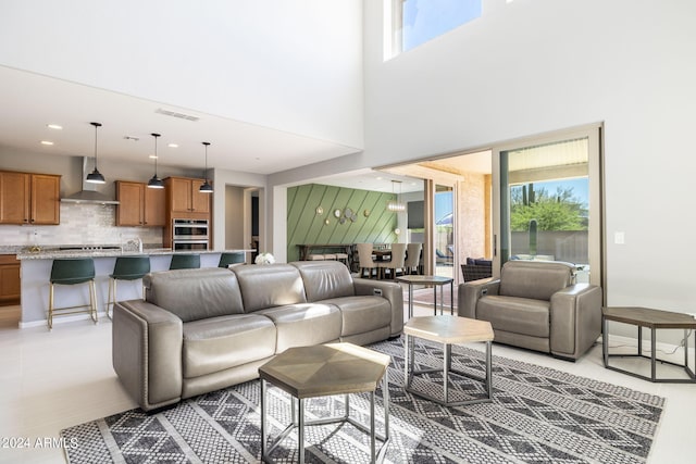 living room featuring a high ceiling