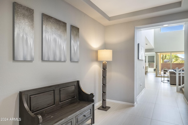 hall featuring light tile patterned floors