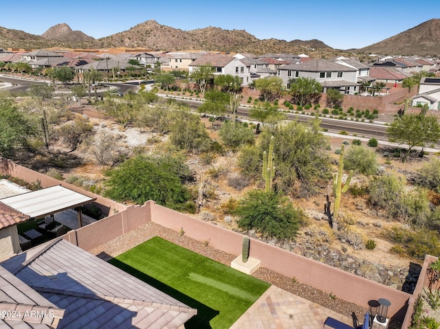 birds eye view of property with a mountain view