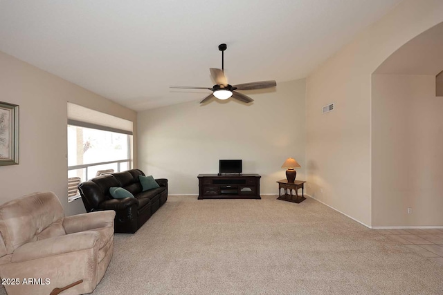4081 N 156th Dr, Goodyear, AZ 85395 - living room with carpet floors, arched walkways, a ceiling fan, lofted ceiling, and baseboards