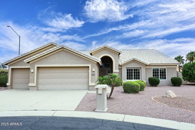 4081 N 156th Dr, Goodyear, AZ 85395 - ranch-style house with a garage, stucco siding, driveway, and a tiled roof