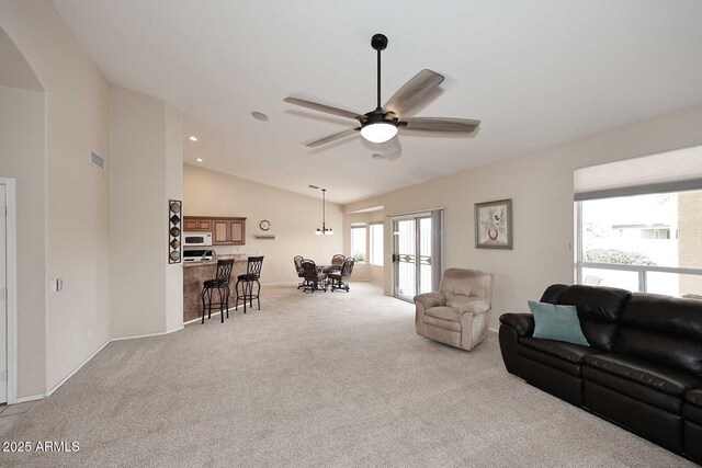 4081 N 156th Dr, Goodyear, AZ 85395 - living area with vaulted ceiling, carpet flooring, ceiling fan, baseboards, and recessed lighting
