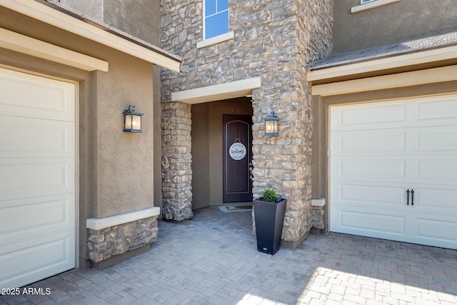 11875 W Lone Tree Trl, Peoria, AZ 85383 - property entrance with stucco siding, stone siding, and an attached garage