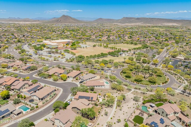 11875 W Lone Tree Trl, Peoria, AZ 85383 - aerial overview of property's location with a mountainous background and nearby suburban area
