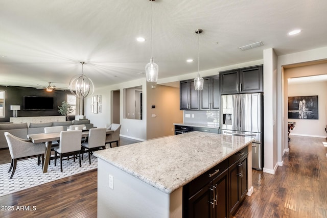 11875 W Lone Tree Trl, Peoria, AZ 85383 - kitchen with stainless steel fridge with ice dispenser, baseboards, dark wood-style flooring, open floor plan, and recessed lighting