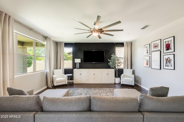 11875 W Lone Tree Trl, Peoria, AZ 85383 - living room with ceiling fan, dark wood-type flooring, plenty of natural light, and baseboards