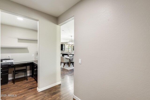 11875 W Lone Tree Trl, Peoria, AZ 85383 - hallway featuring dark wood-style floors, a chandelier, and baseboards
