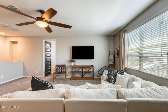 11875 W Lone Tree Trl, Peoria, AZ 85383 - carpeted living area with baseboards and a ceiling fan