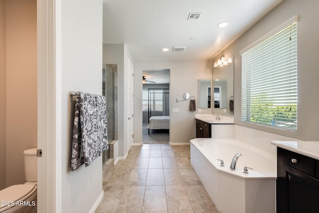 11875 W Lone Tree Trl, Peoria, AZ 85383 - ensuite bathroom featuring vanity, healthy amount of natural light, a stall shower, a bath, and recessed lighting
