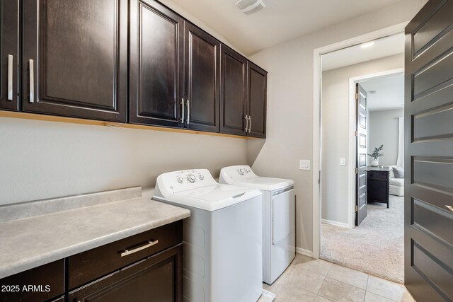 11875 W Lone Tree Trl, Peoria, AZ 85383 - laundry area featuring cabinet space, washing machine and clothes dryer, light colored carpet, light tile patterned floors, and baseboards
