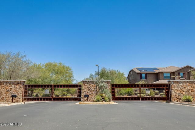 11875 W Lone Tree Trl, Peoria, AZ 85383 - view of street with a gate, curbs, and a gated entry