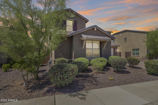 11875 W Lone Tree Trl, Peoria, AZ 85383 - traditional-style home featuring stucco siding, a tile roof, and an attached garage