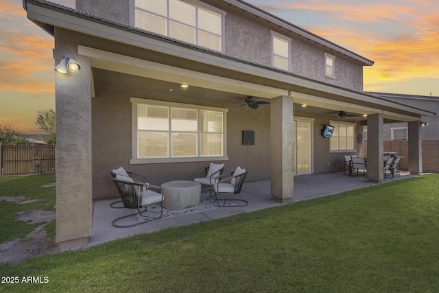 11875 W Lone Tree Trl, Peoria, AZ 85383 - back of property featuring ceiling fan, stucco siding, and a patio area