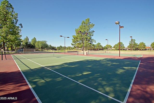 view of sport court featuring basketball hoop