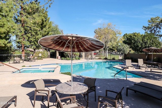 view of swimming pool with a patio area