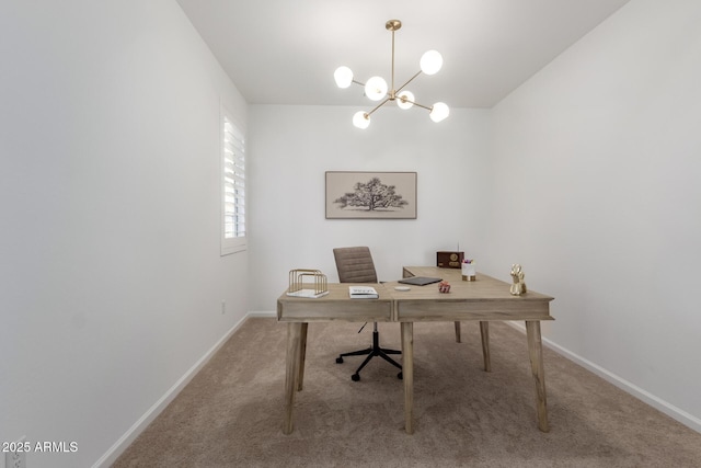 carpeted office space featuring baseboards and a chandelier