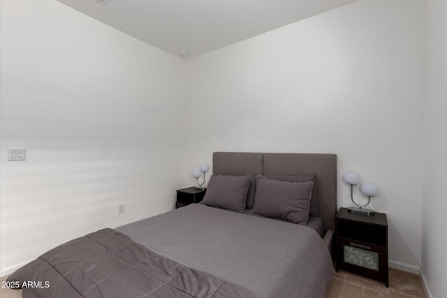 carpeted bedroom with baseboards