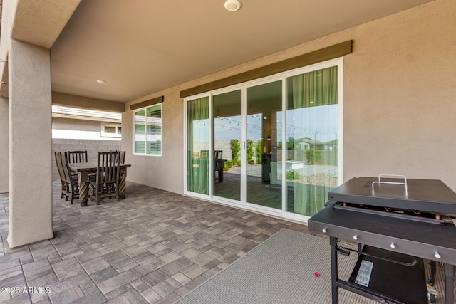 view of patio / terrace featuring fence and outdoor dining area