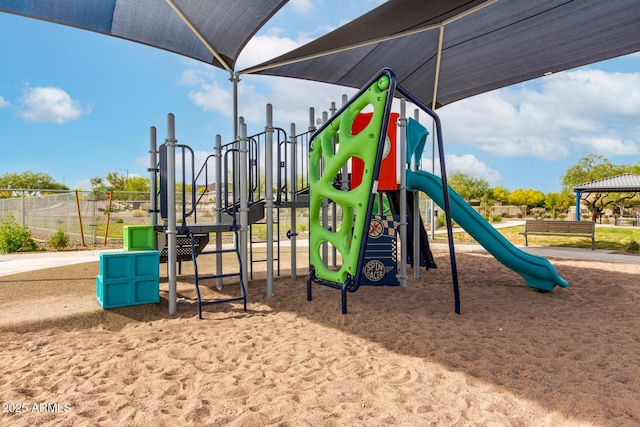 community jungle gym featuring fence